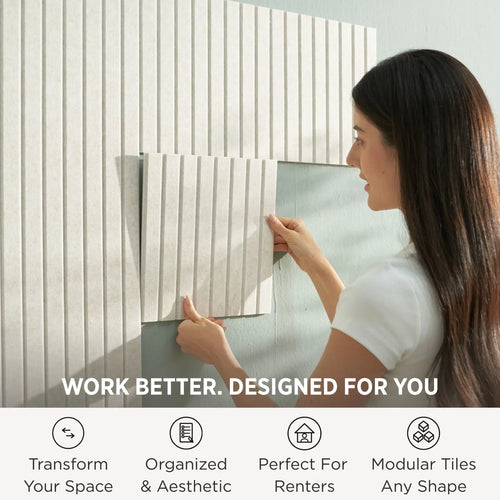 Woman installing felt wall tiles on home office wall — modular bulletin board no tools needed