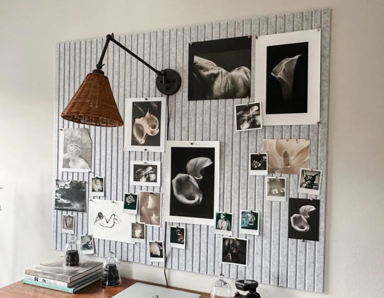 felt bulletin board wall tiles used as large gallery pin board with black and white art prints featuring a lifestyle home decor essential